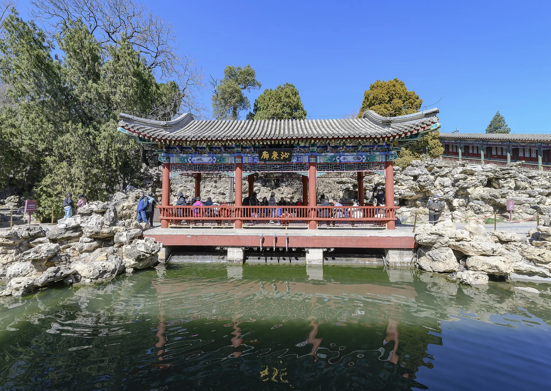 Rocks, a pond and historic garden buildings in Jingxin Studio.