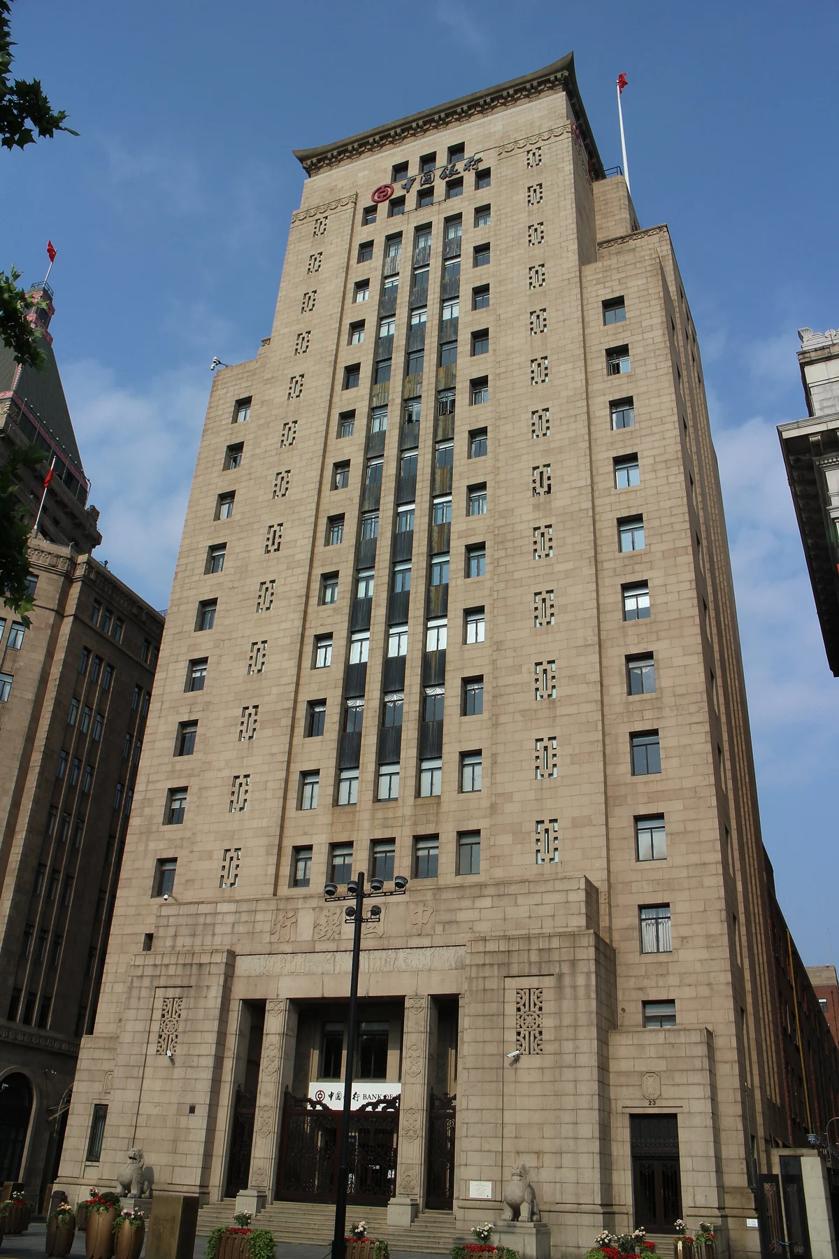 The tall Bank of China facade with strong vertical lines and Chinese decorative elements.