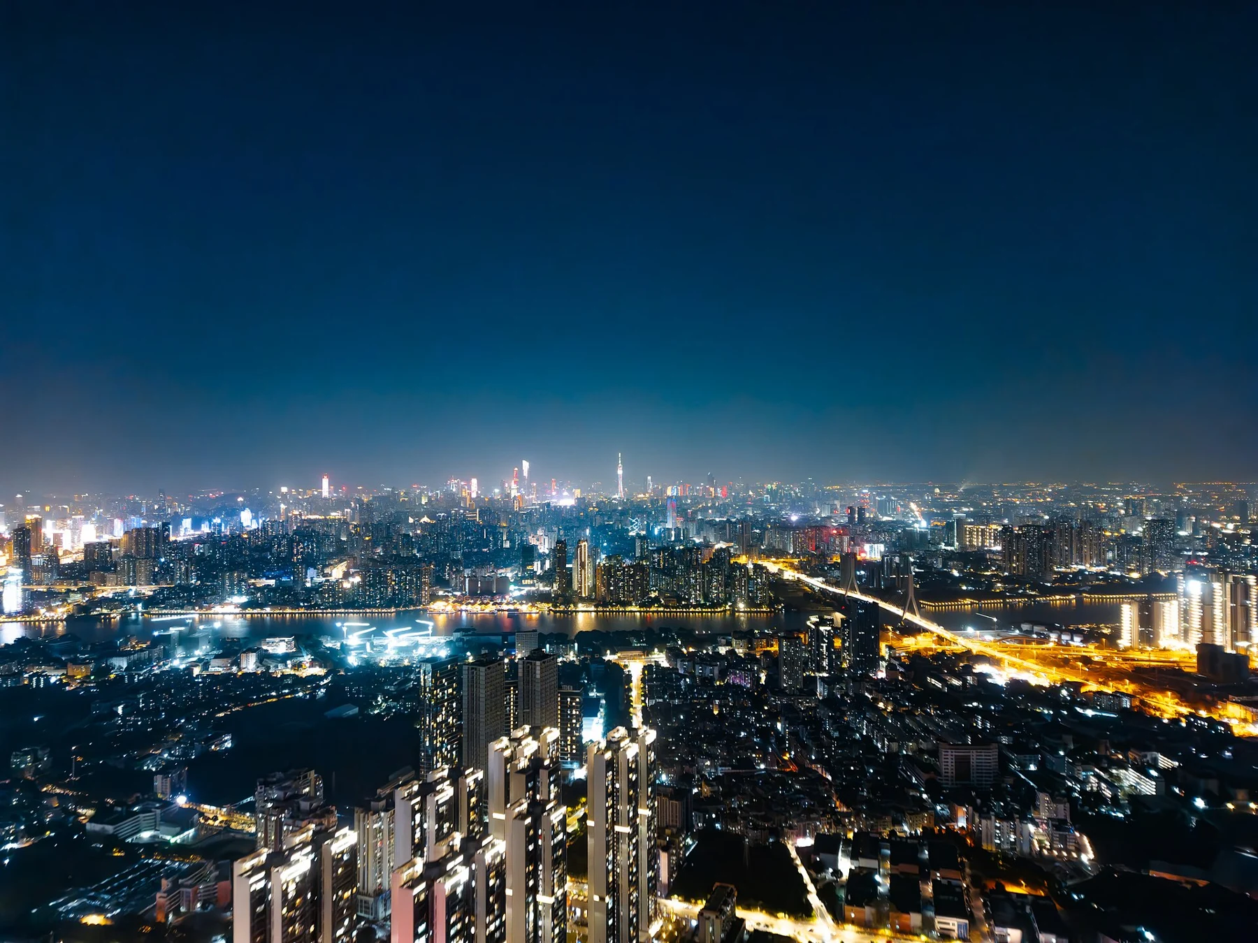 Distant Guangzhou night skyline photographed from Fangcun.