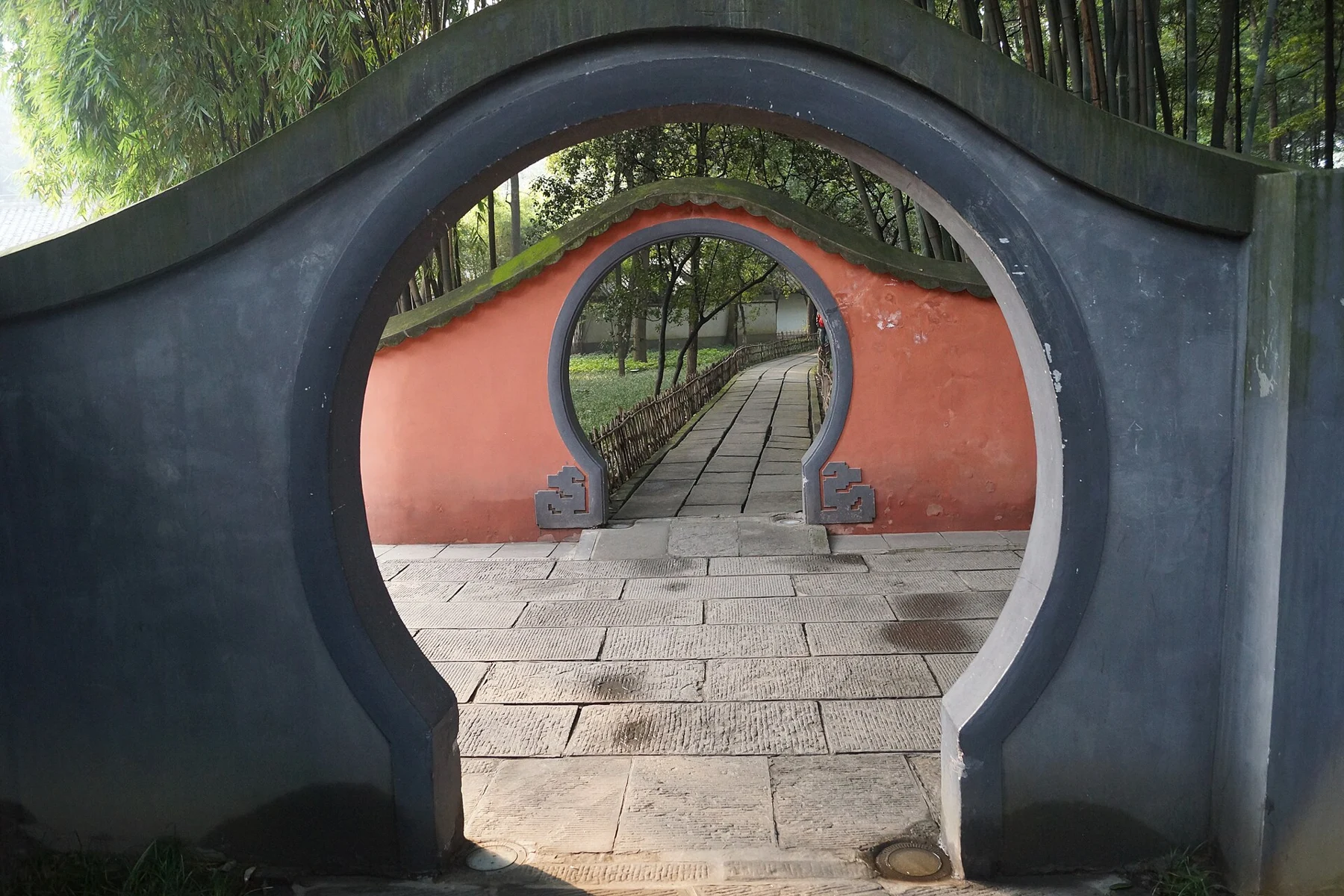 Curved openings frame a succession of garden walls, photographed in 2013.