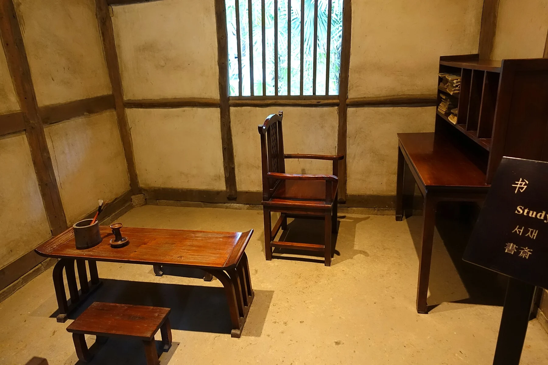 A writing table, chair and shelves in the reconstructed study display, photographed in 2015.