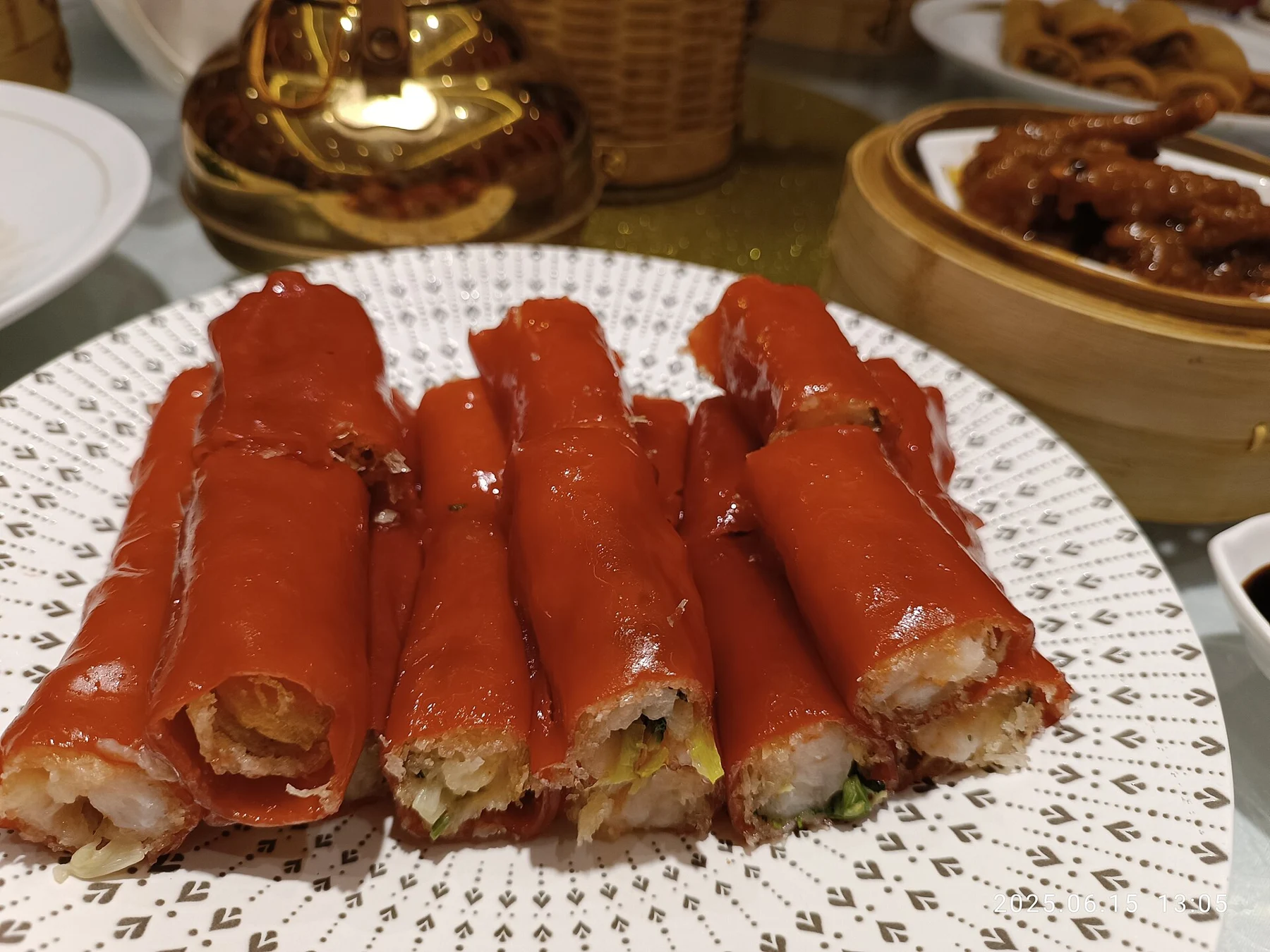 Red rice rolls cut into short pieces and served on a patterned plate