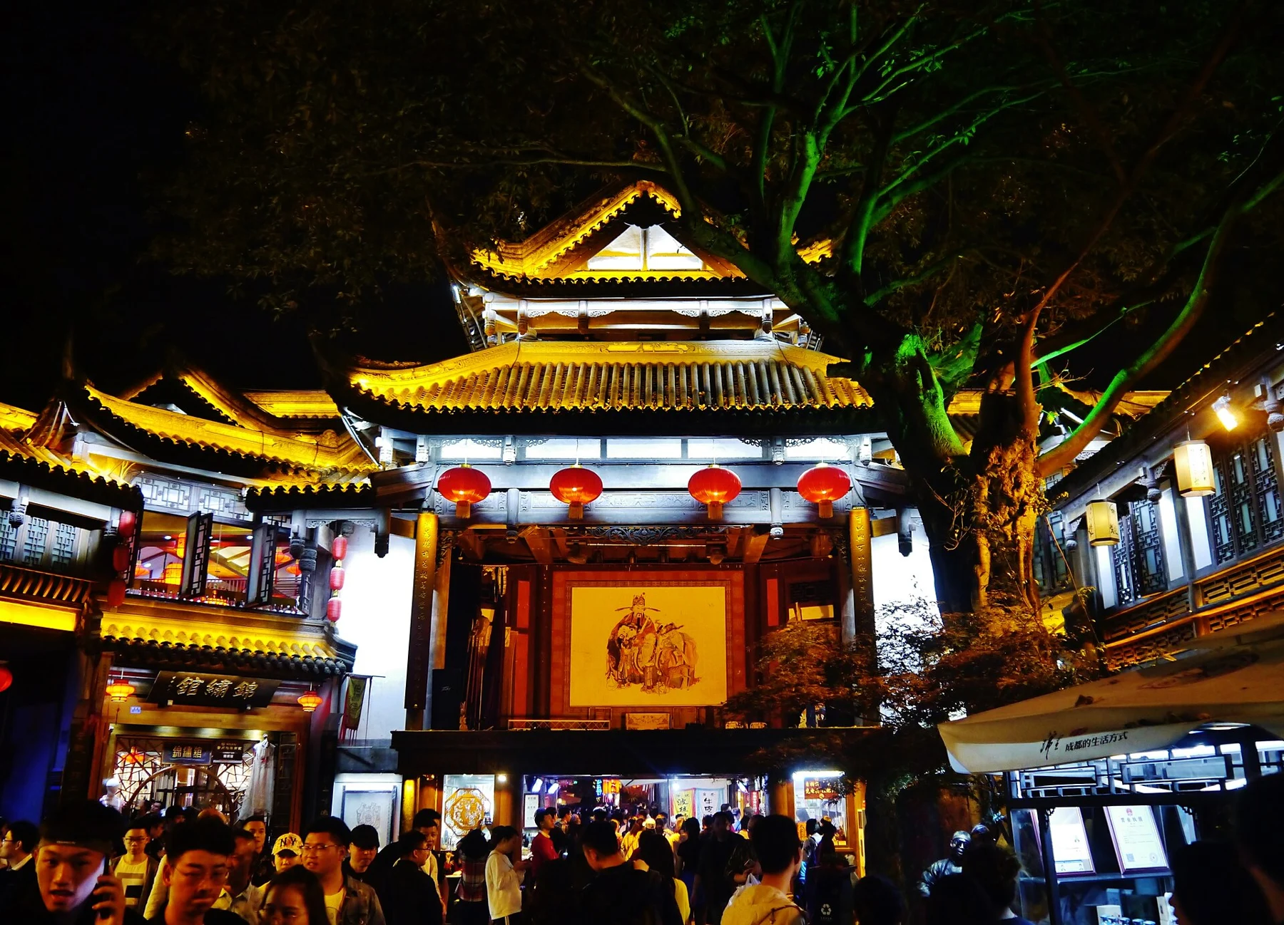 Illuminated theatre stage with people in the foreground