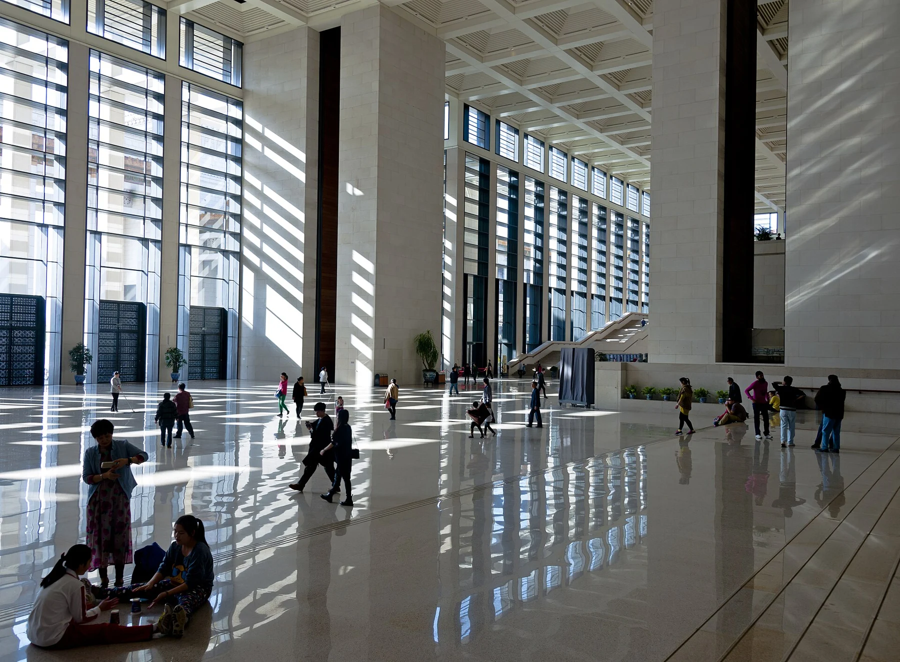 Visitors in the spacious stone-lined foyer of the National Museum of China.