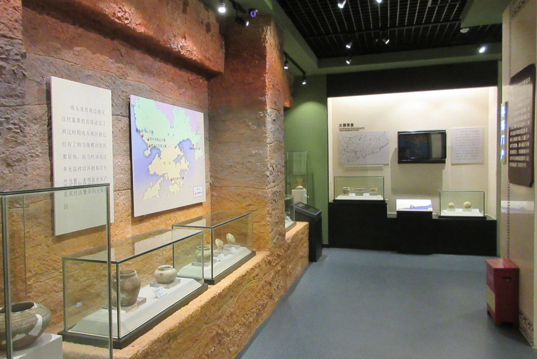 Museum cases, pottery and interpretive panels in a 2017 gallery