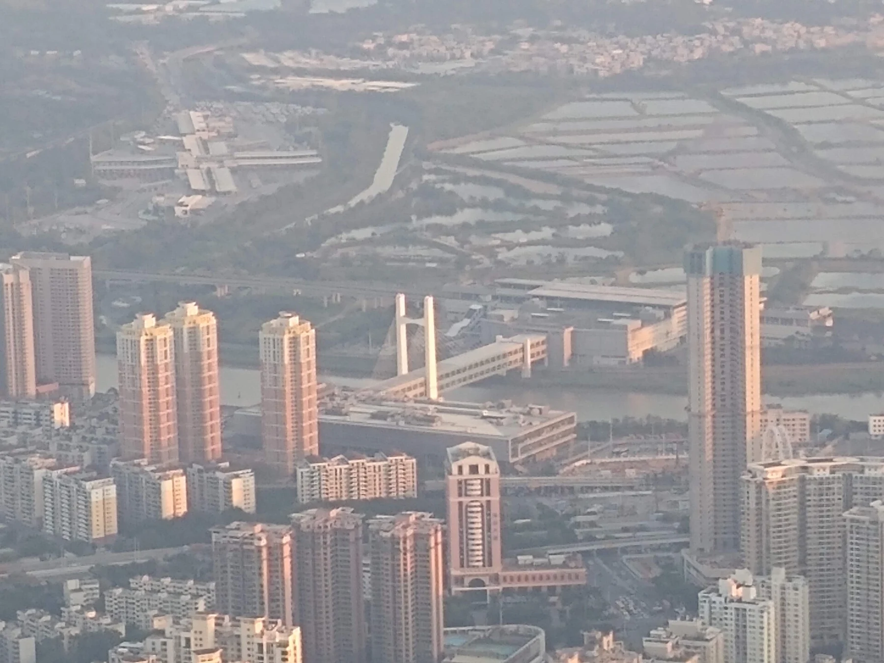 High-rise buildings beside waterways and extensive shallow-water areas.