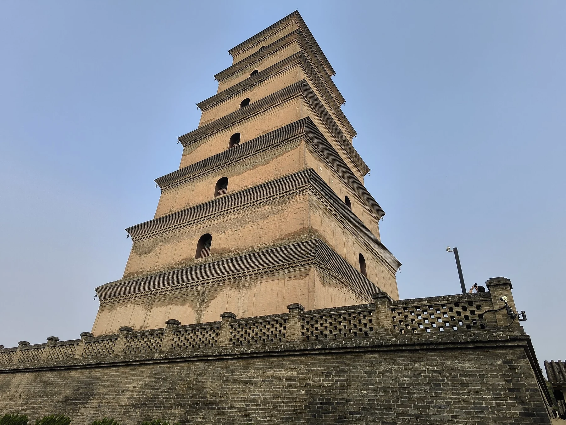 Oblique close view of the pagoda’s tapering brick storeys and eaves.