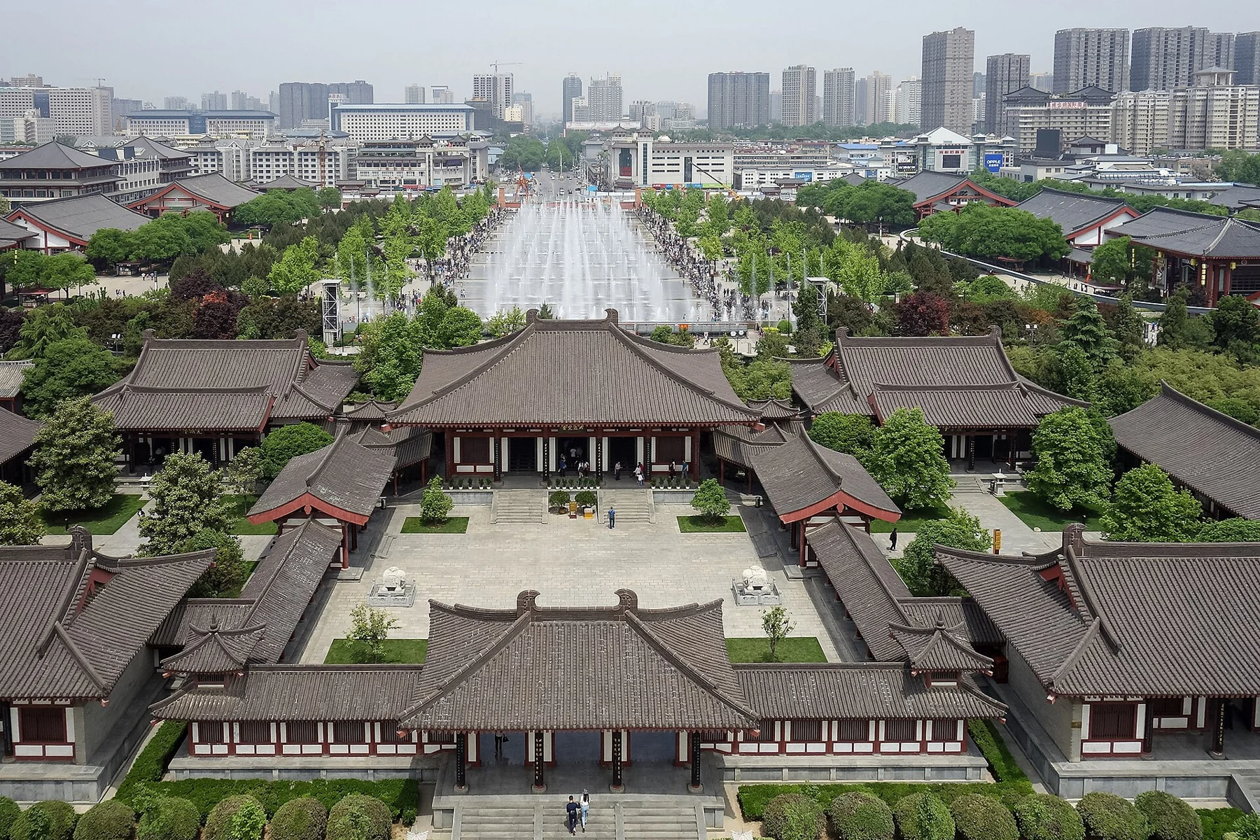 Temple roofs and courtyard below a view towards the North Square and modern Xi’an.