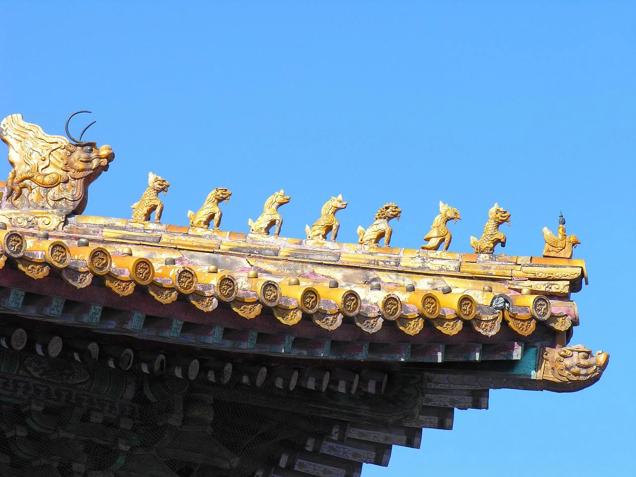 A row of animal figures on the yellow glazed roof corner of the Hall of Supreme Harmony.