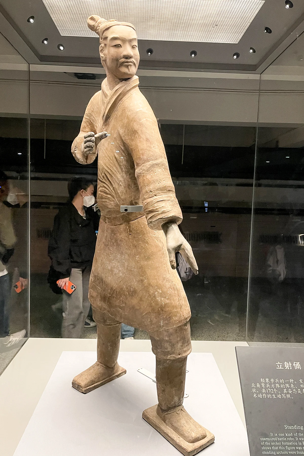 A standing terracotta archer