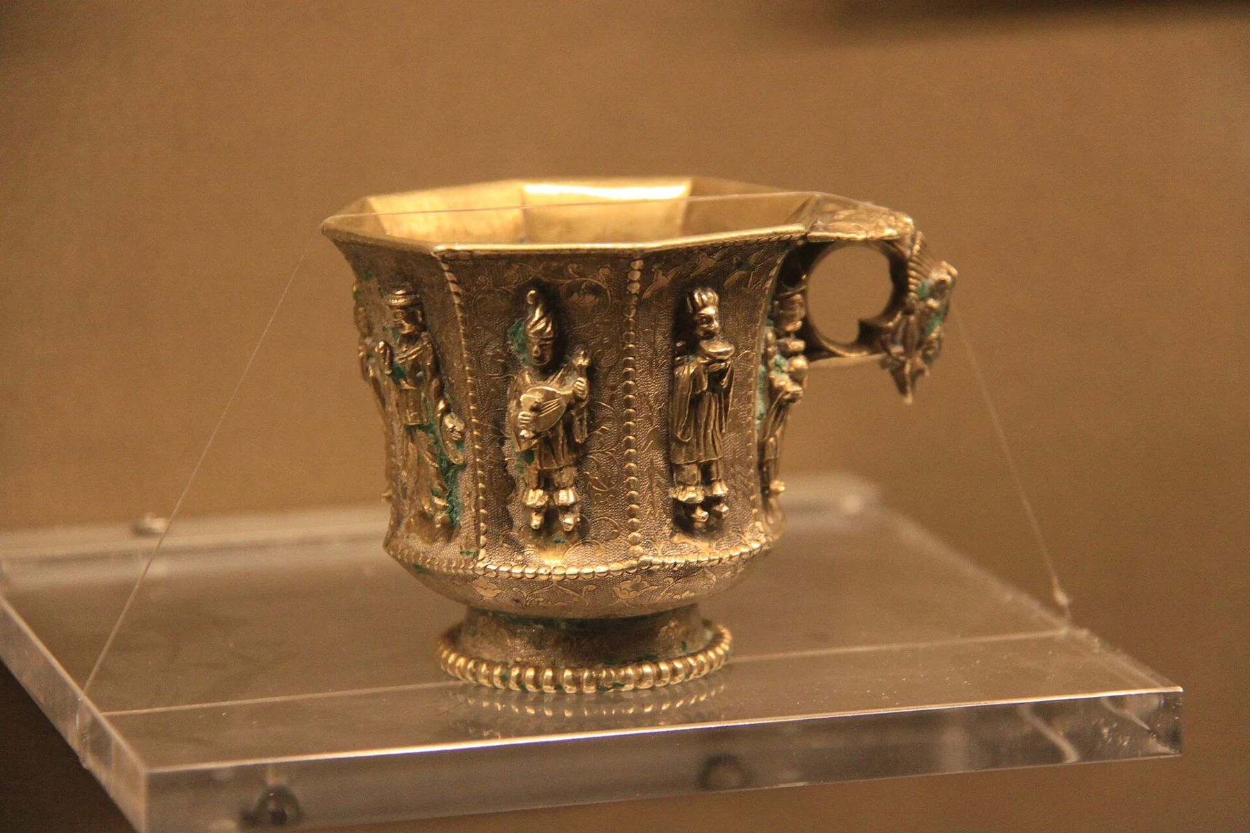 Gilt silver octagonal cup with musician and dancer decoration