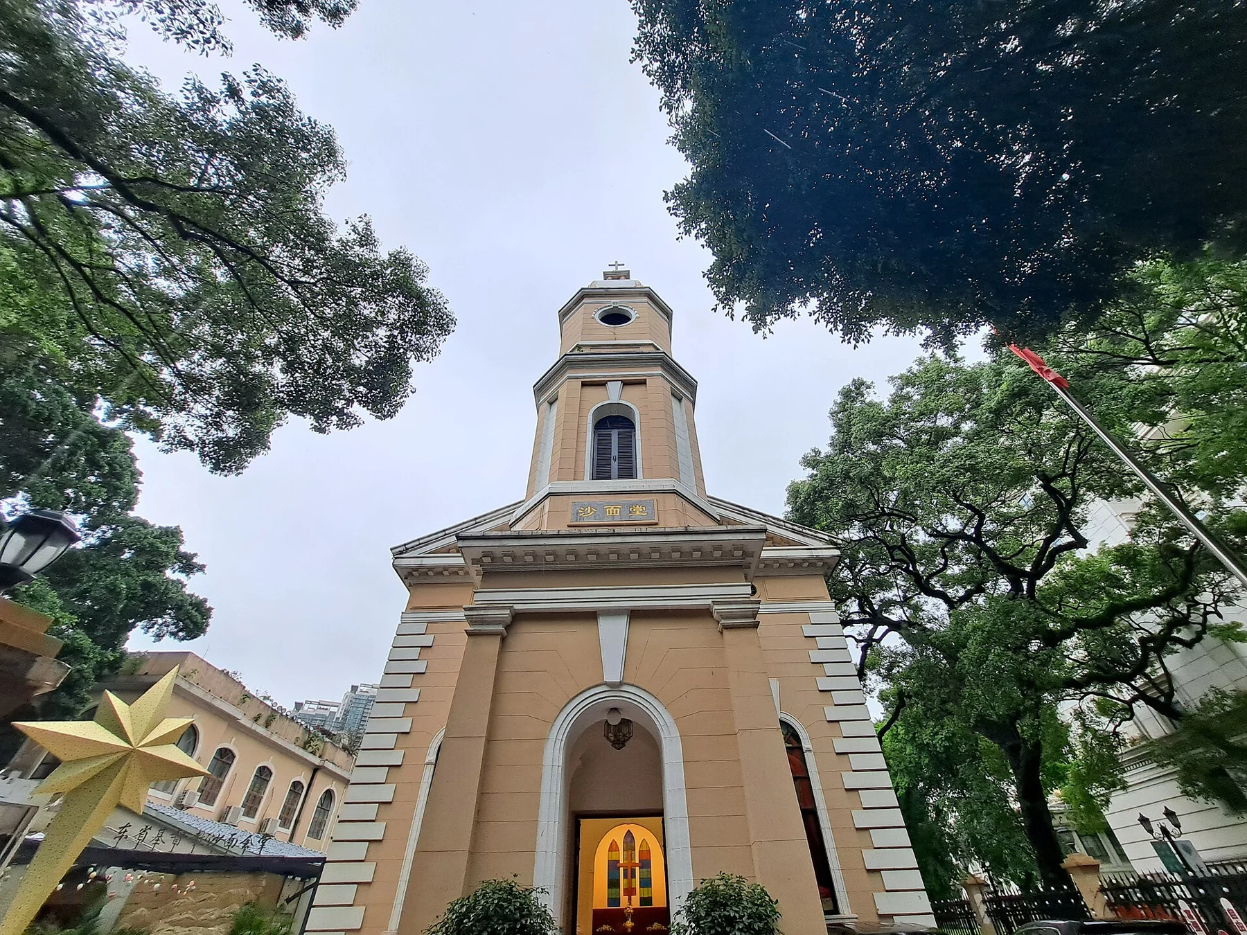Front of the yellow church at No. 60 Shamian South Street, with a tower and entrance.