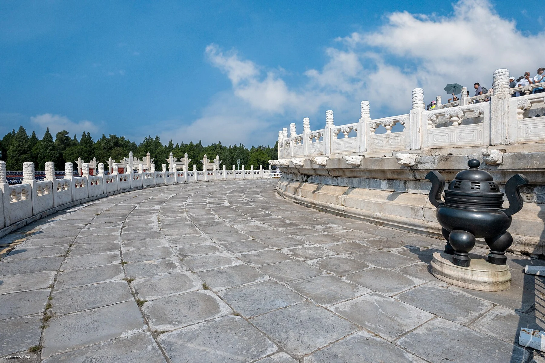 Curved stone paving and white balustrades around the Circular Mound Altar.