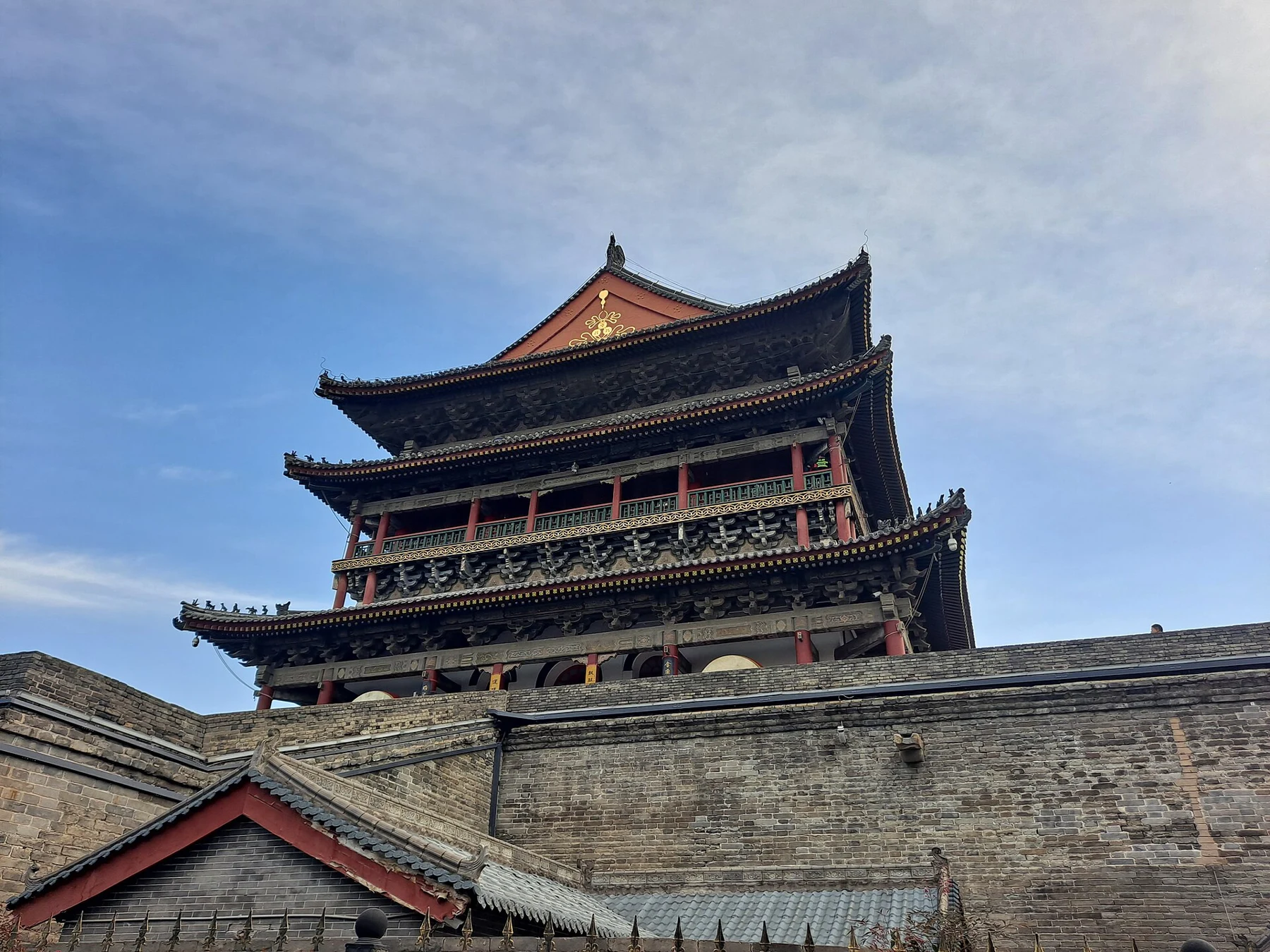 The Drum Tower’s long roof and corner above the high brick platform.