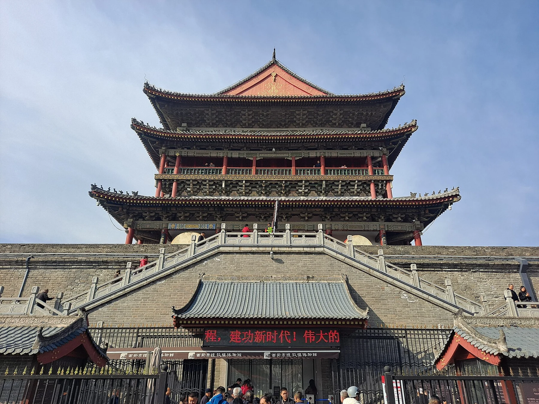 End-on view of the Drum Tower’s hipped-gable roof and masonry-platform stairs.