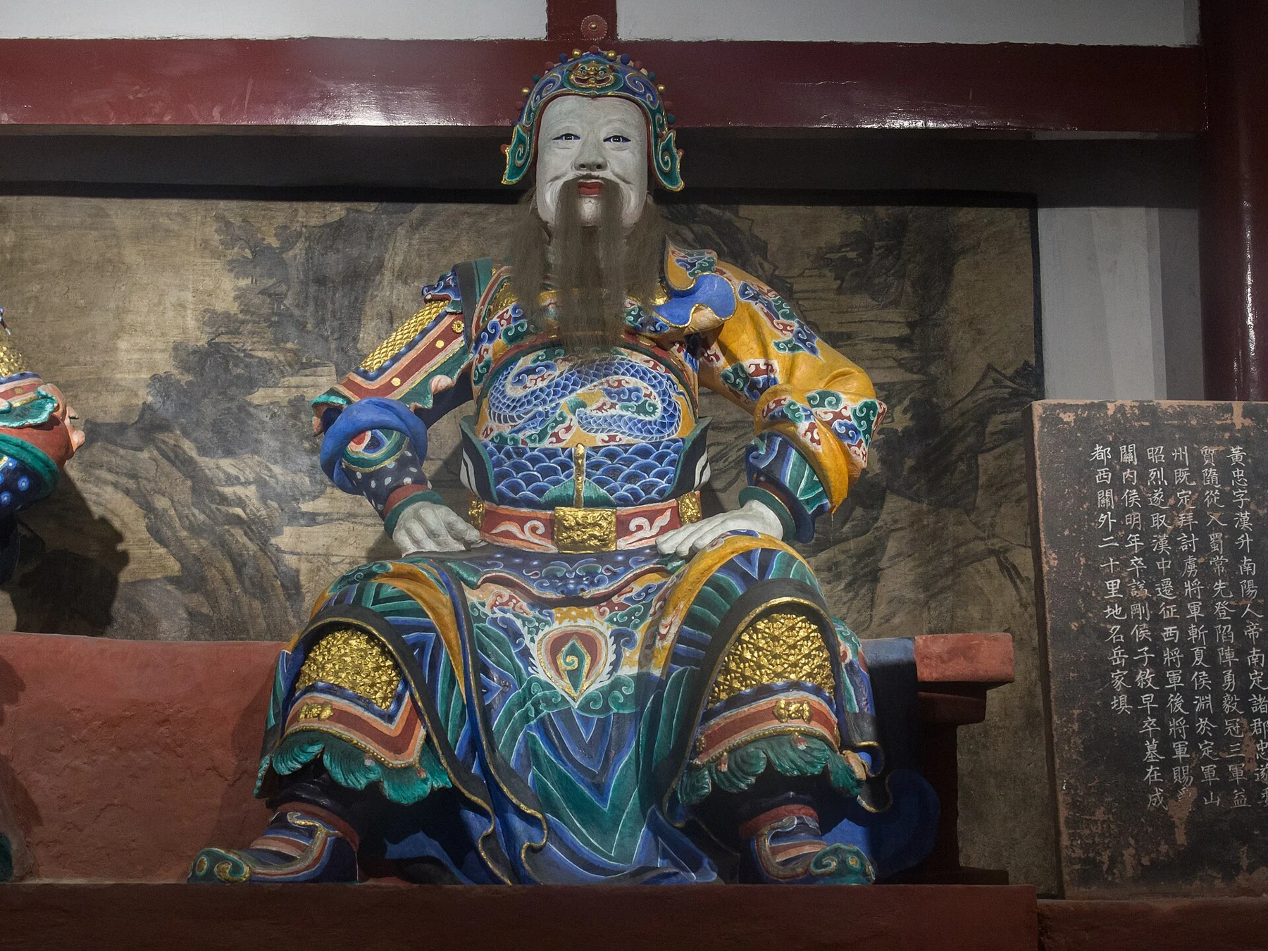 Seated armoured Huang Zhong figure with a long beard